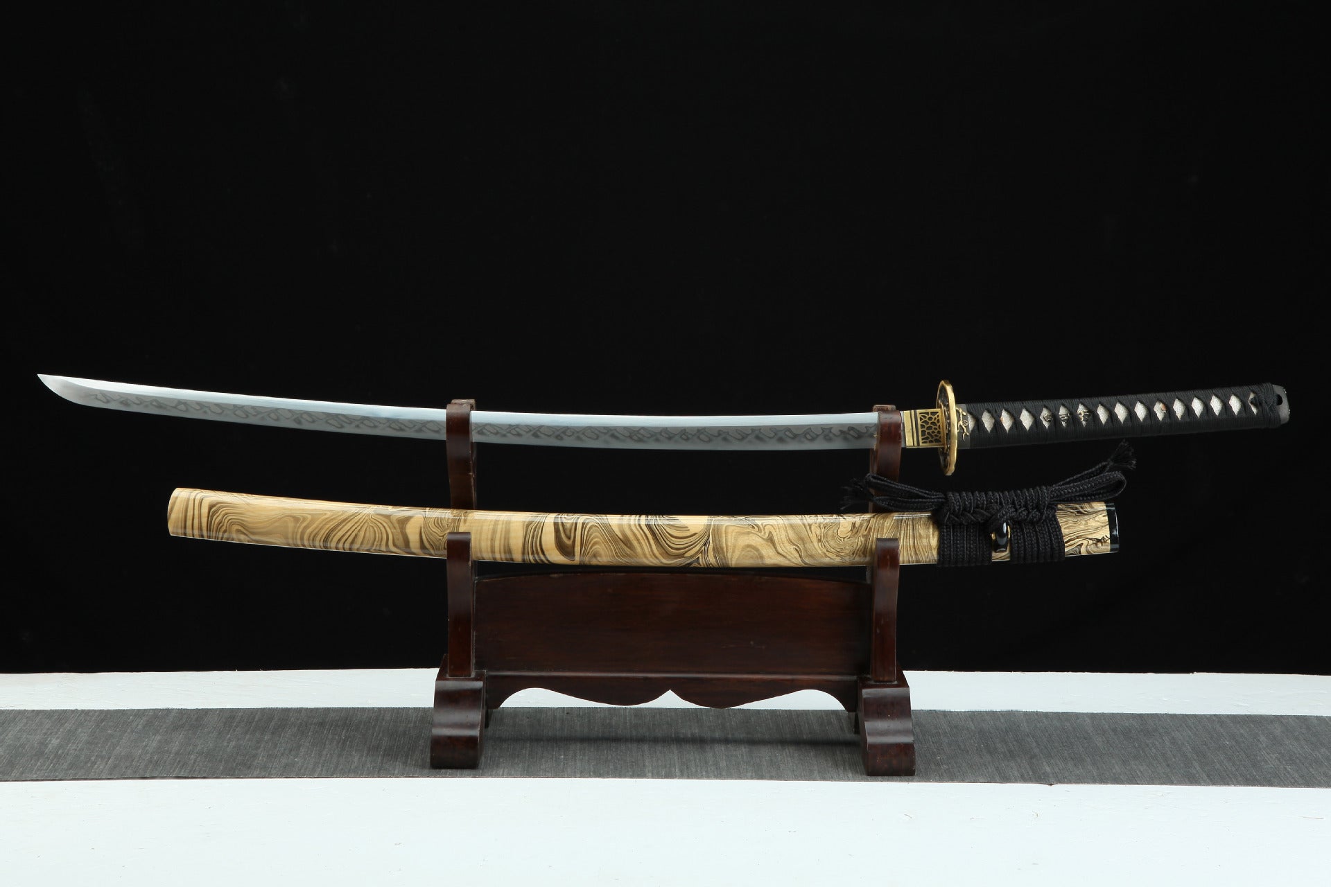 Hand-forged Sakura X katana with T10 high carbon steel blade, featuring copper fittings and a unique hamon created through the clay tempering process.