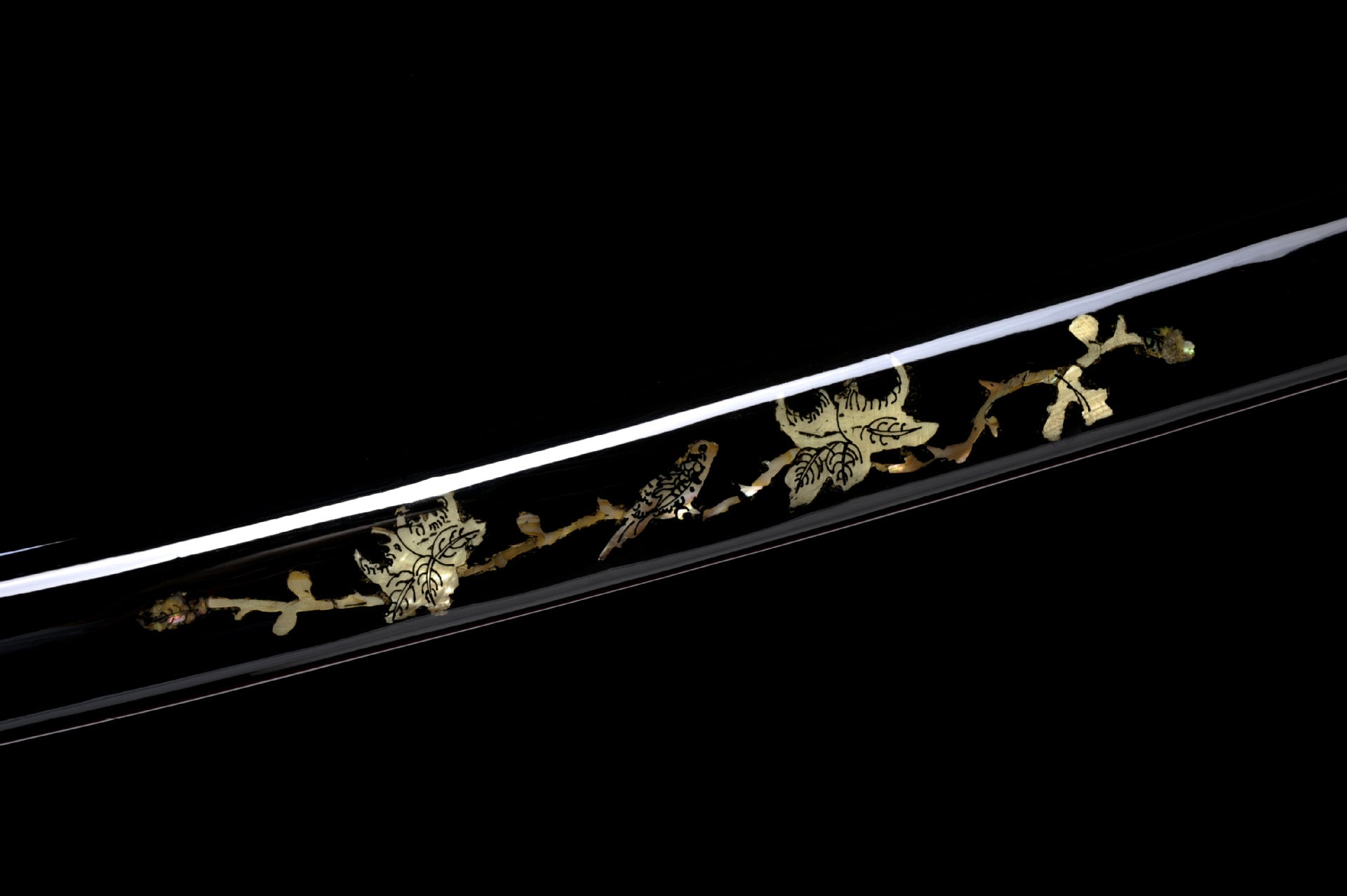 Black saya inlaid with shell pieces.