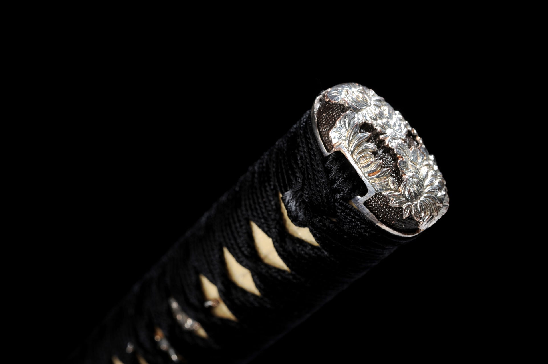 Silver-plated engraved katana pommel.