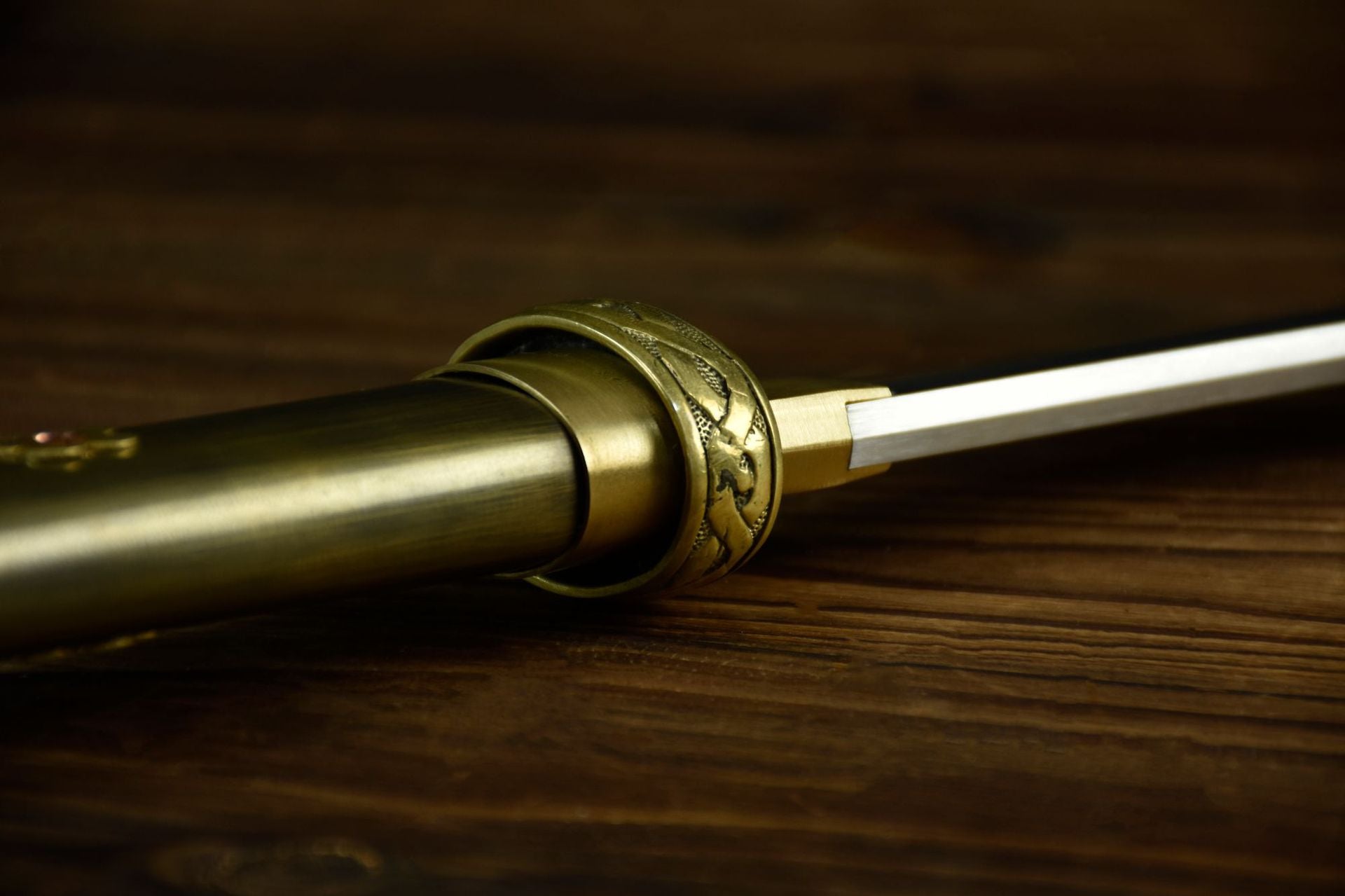 A small circular copper tsuba designed for a katana, featuring a minimalist shape and durable craftsmanship.