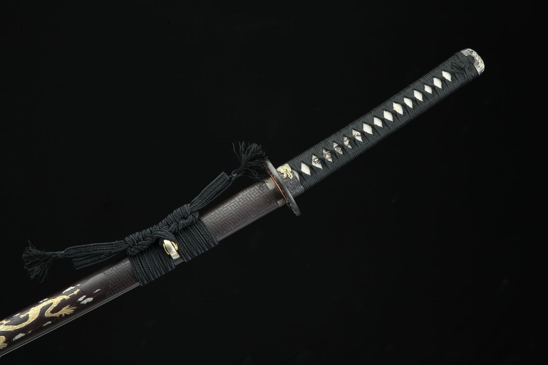 ull view of the Ssangyong katana's handle and sageo, showcasing the expertly wrapped tsuka-ito and the traditional sageo cord.