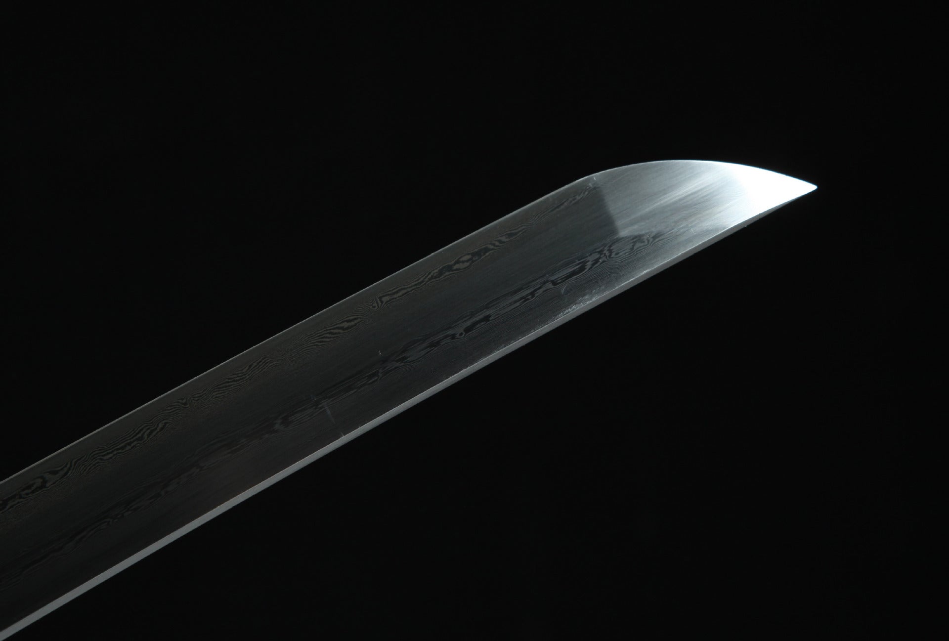 Close-up of the Ssangyong katana's kissaki, crafted from Damascus steel.
