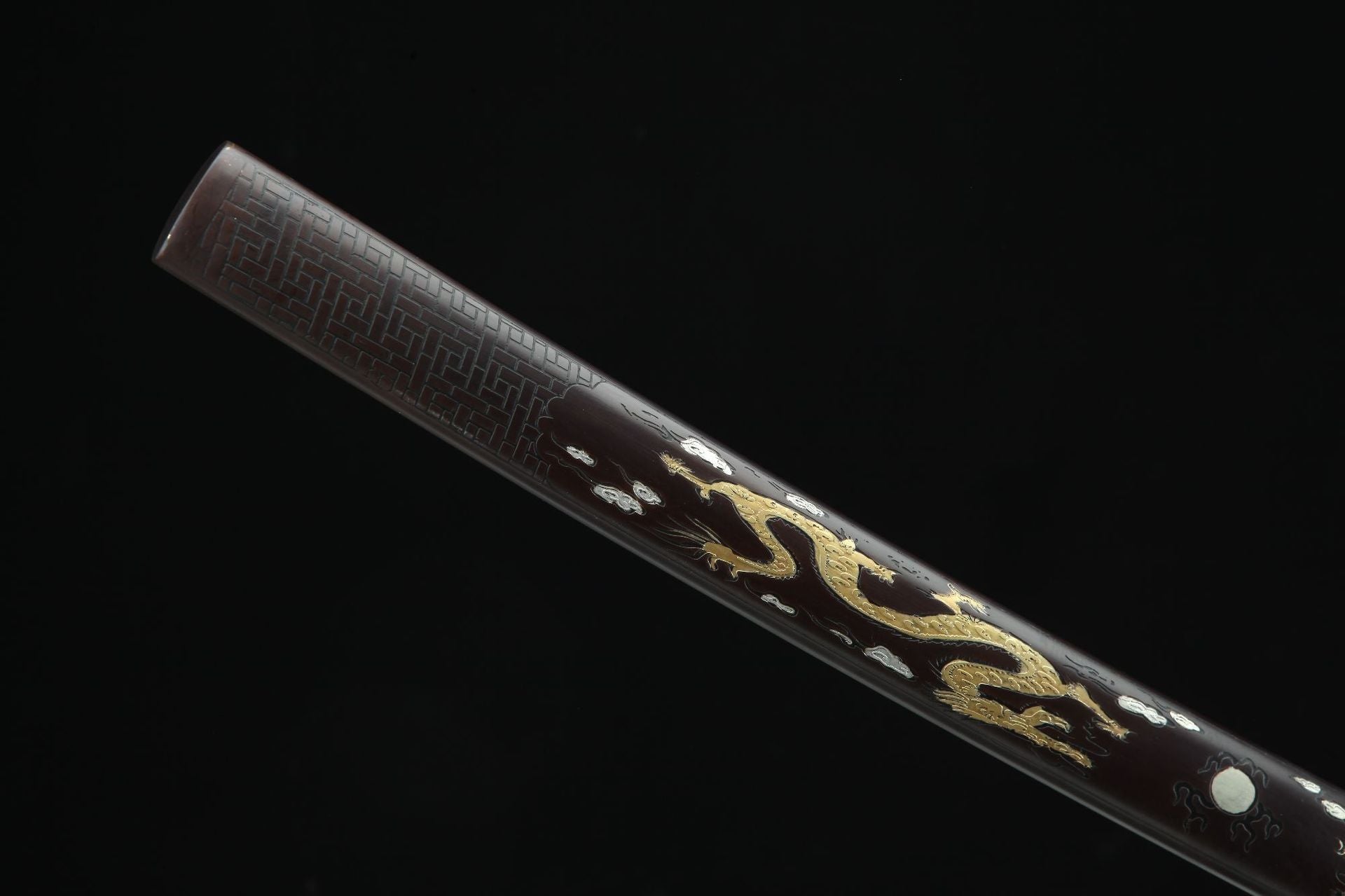 Close-up view of the Ssangyong katana's saya featuring detailed shell inlay of a golden loong.