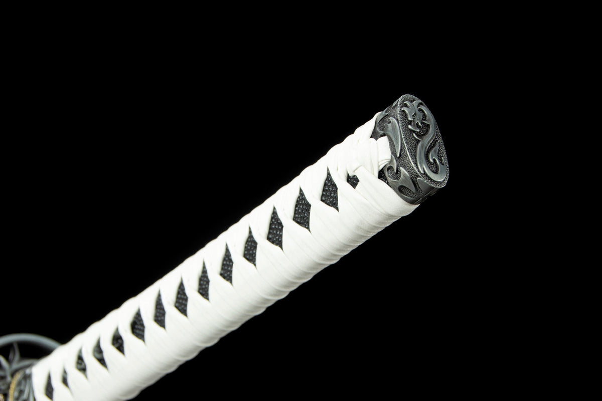 Detail view of the Clouded Dragon Katana, showing the white handle and illustrated saya