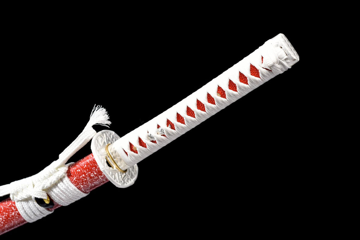 Close view of the white wrapped handle and tsuba
