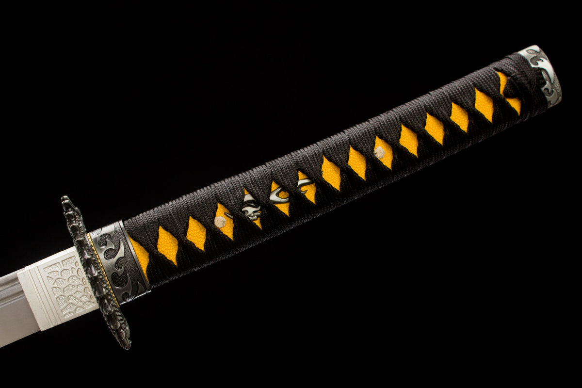 The Night Coil Katana, showing the long gold coil motif