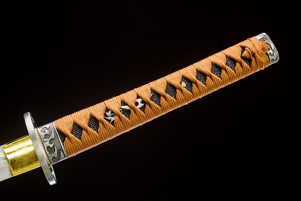 Close-up of the Aureate Koi Katana’s orange handle wrap and ornate metal end fitting