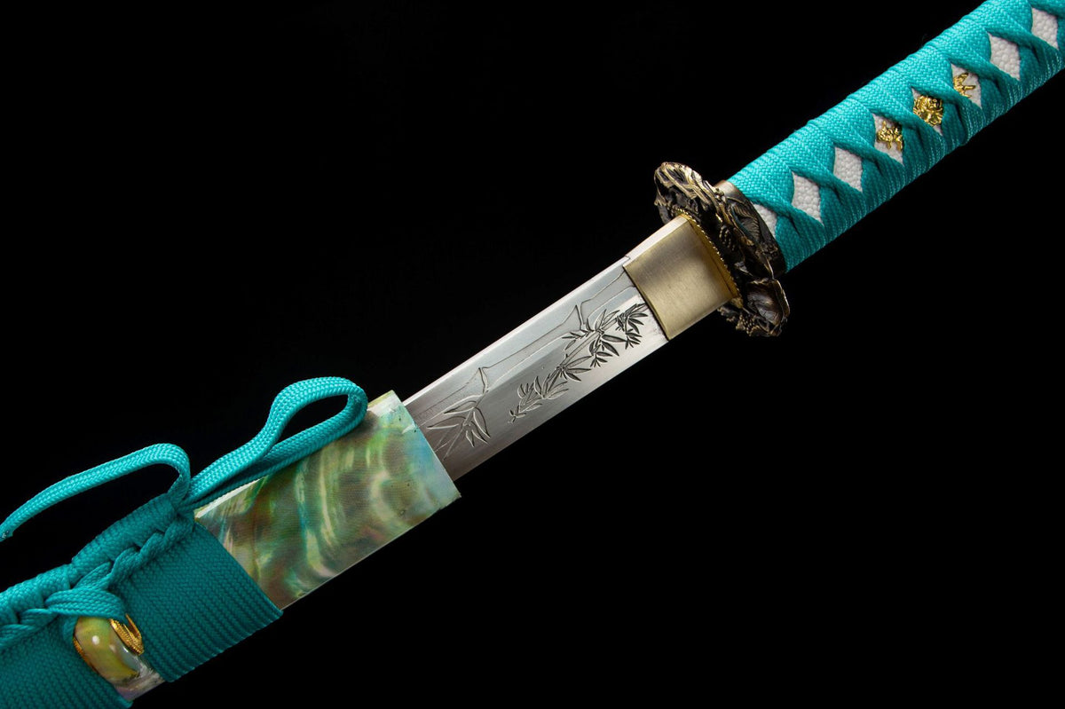 Detail view of the Turquoise Pearl Katana, showing the turquoise handle wrap and green marbled saya