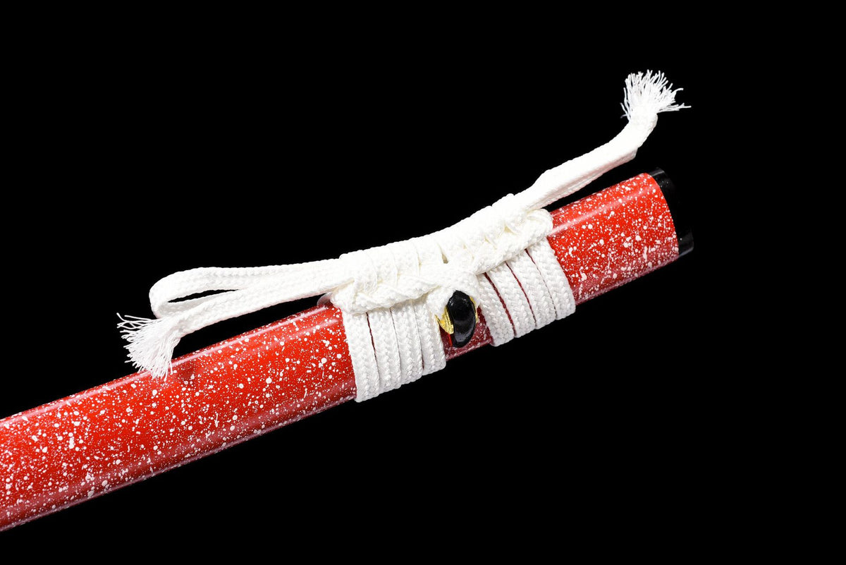 Close view of the white sageo tied around the red speckled saya