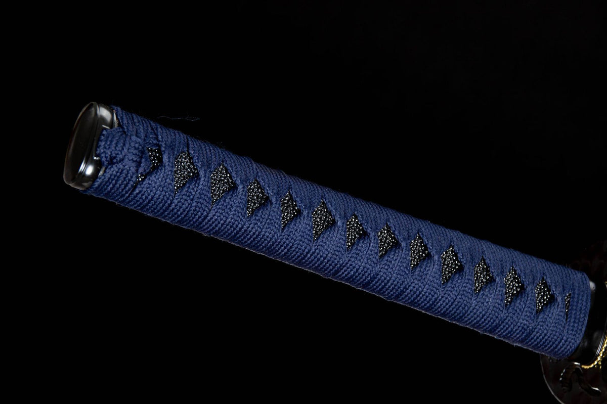 The Inkstorm Katana, showing the dark blade with pale etched motifs