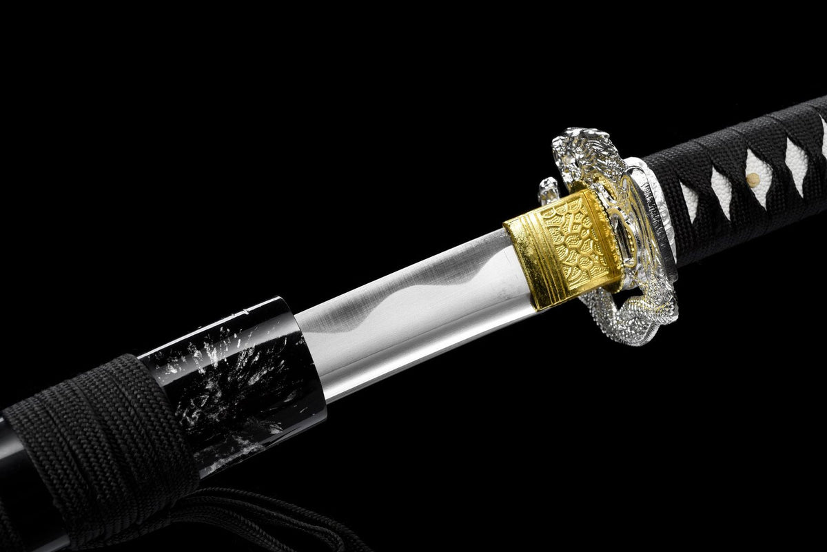 Black handle wrap over white textured underlayer with alloy details