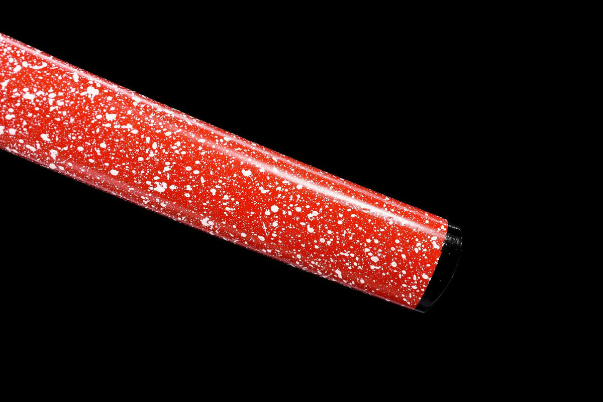 Close view of the red speckled saya finish and black end fitting