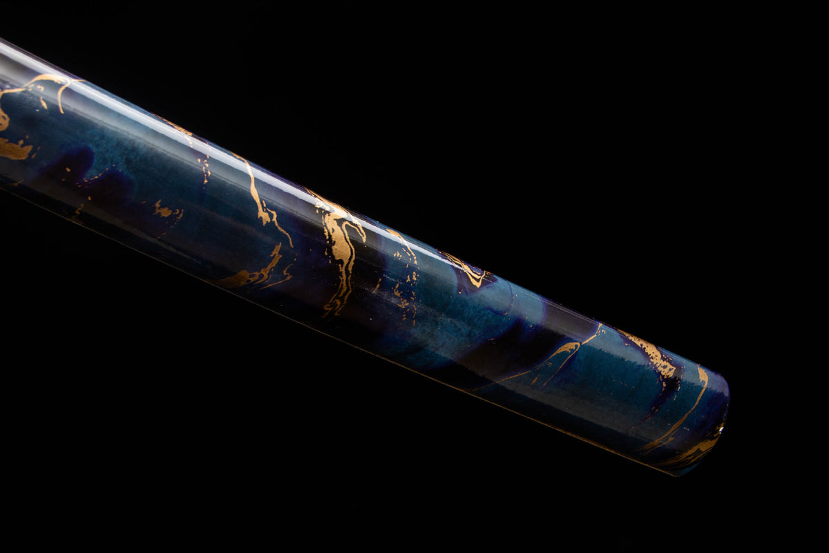Midnight Studwork Katana showing the polished blade, studded handle wrap, and blue-and-gold saya