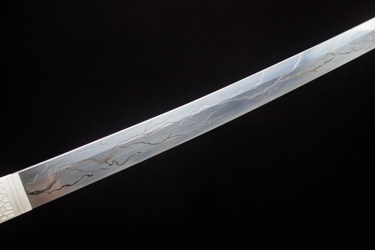 The Moonlit Dragon Katana with the carved lacquer saya and dark mounting