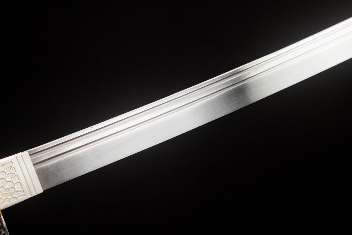 Detail view of the Night Coil Katana, showing the silver blade and black saya