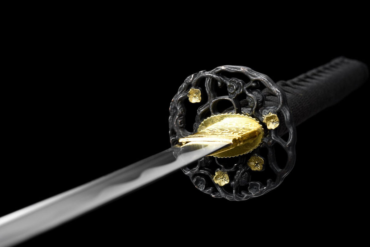 Reverse close-up of Kuro Katana floral-style guard and gold-tone blade collar