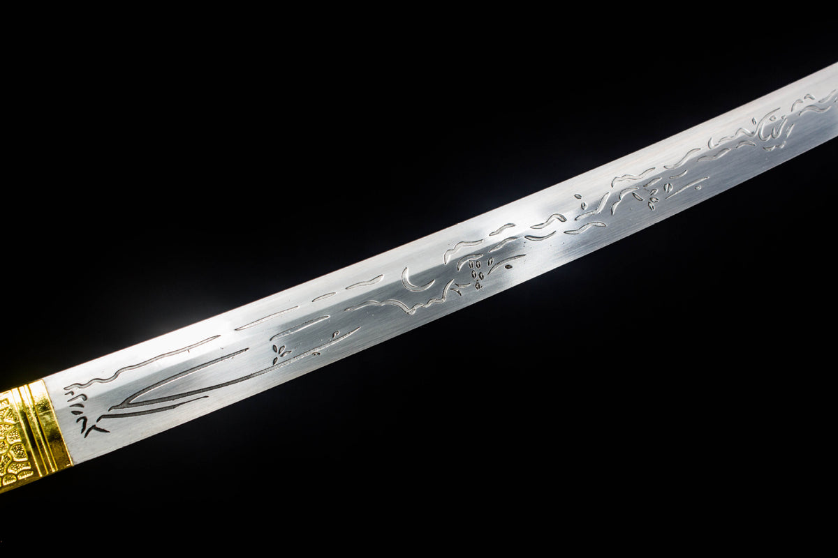 Detail view of the Gilded Coil Katana, showing the etched silver blade and black saya
