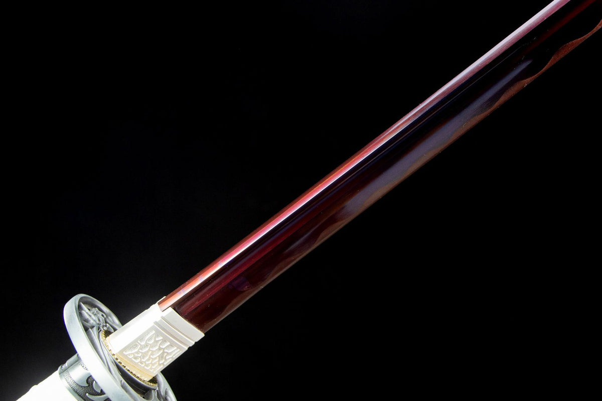 Close-up of the Clouded Dragon Katana’s white handle wrap, guard, and blade collar