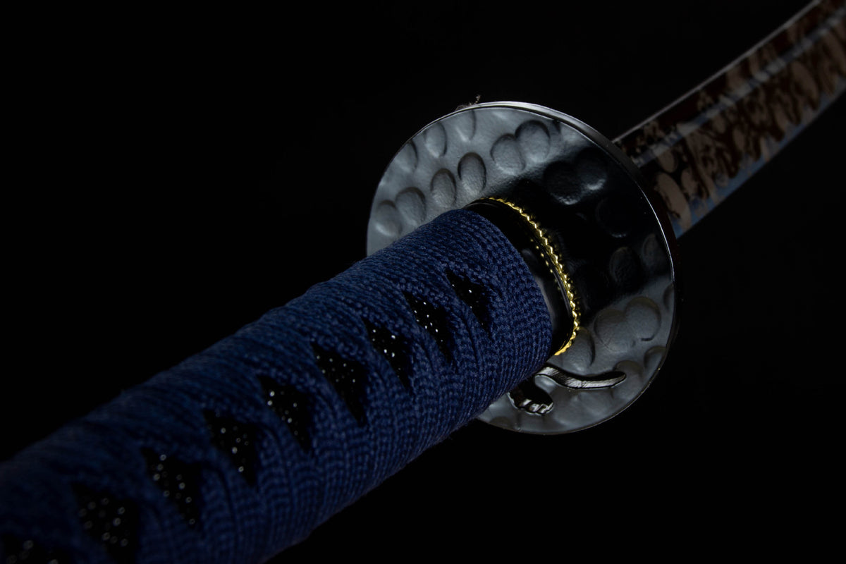 Close-up detail of the Inkstorm Katana, including the glossy black saya with silver floral motifs