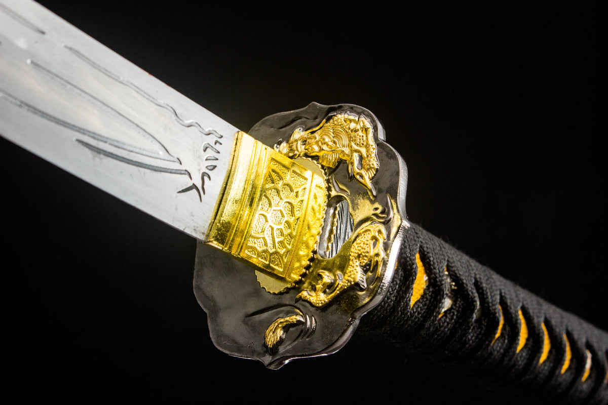 Close-up detail of the Gilded Coil Katana, including the dark handle wrap and fittings