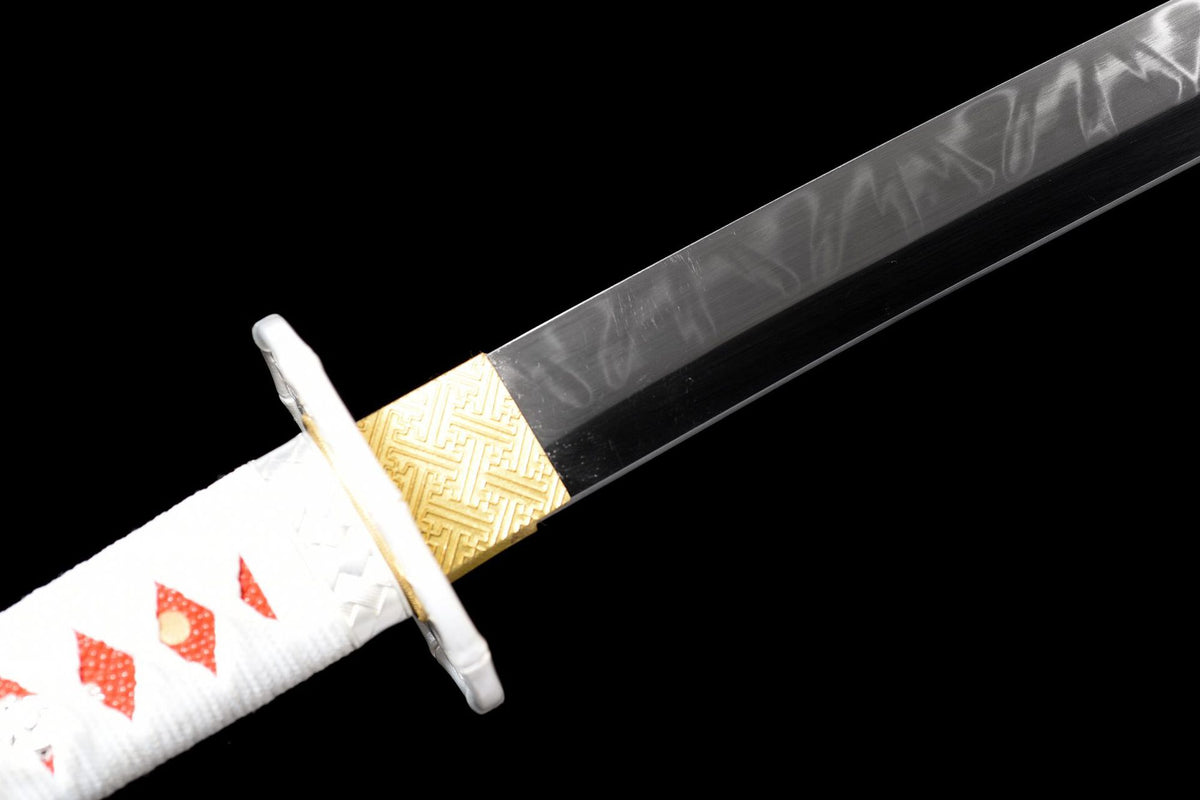 Close view of the black blade base with a visible wave-like surface line