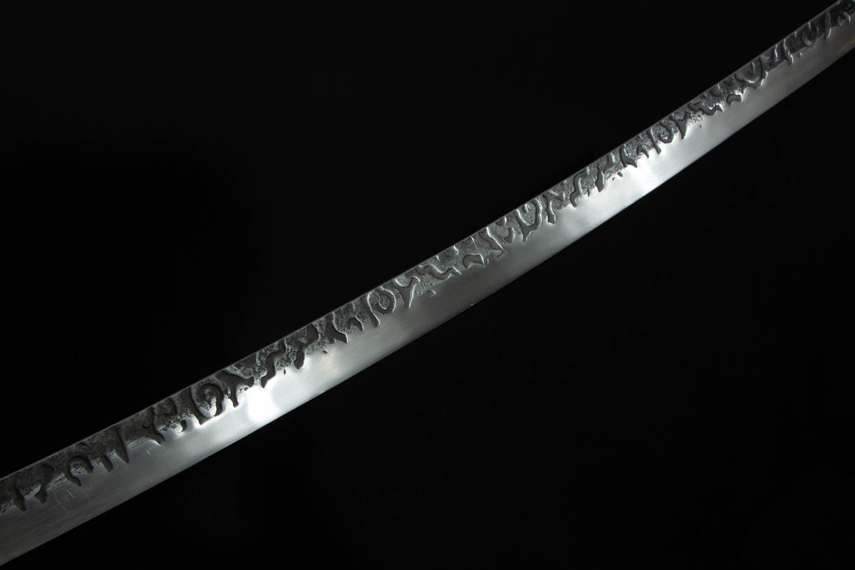 Close-up detail of the Autumn Mist Katana, including the silver blade and ornate guard