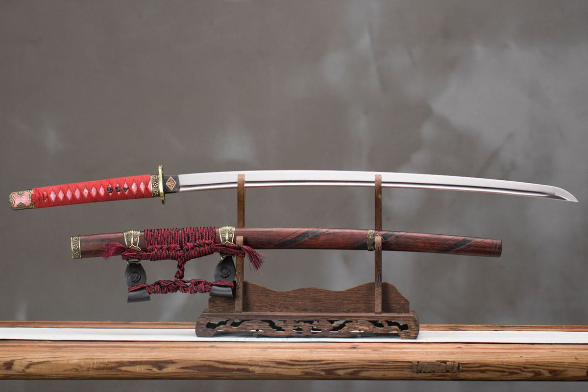 Sekiro Raijin Katana displayed with a red handle wrap, polished blade, and red-and-black patterned saya