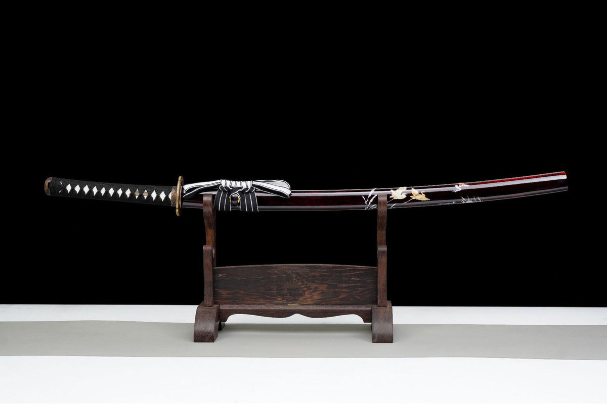 Sheathed Red Crane Katana shown on a wooden display stand
