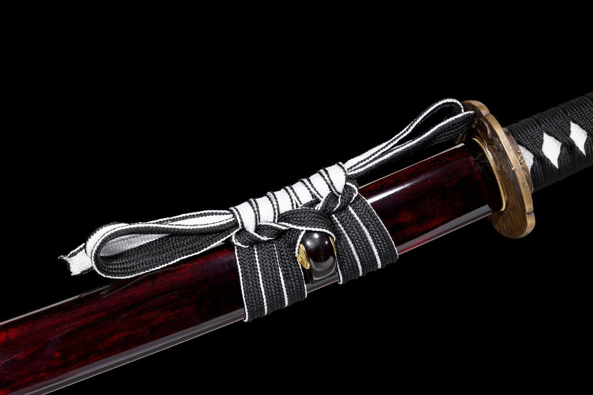 Black-and-white sageo tied around the deep red saya