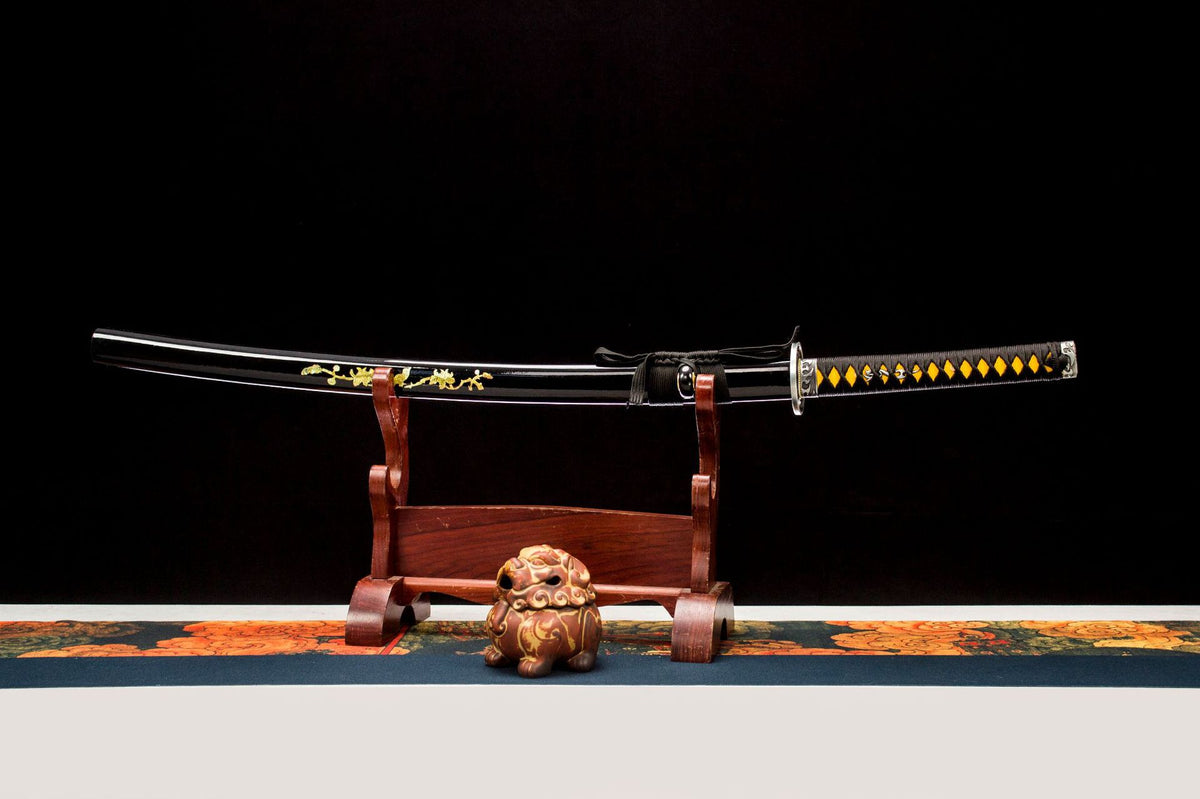 Gilded Dragon Katana displayed unsheathed with a polished blade and black decorated saya