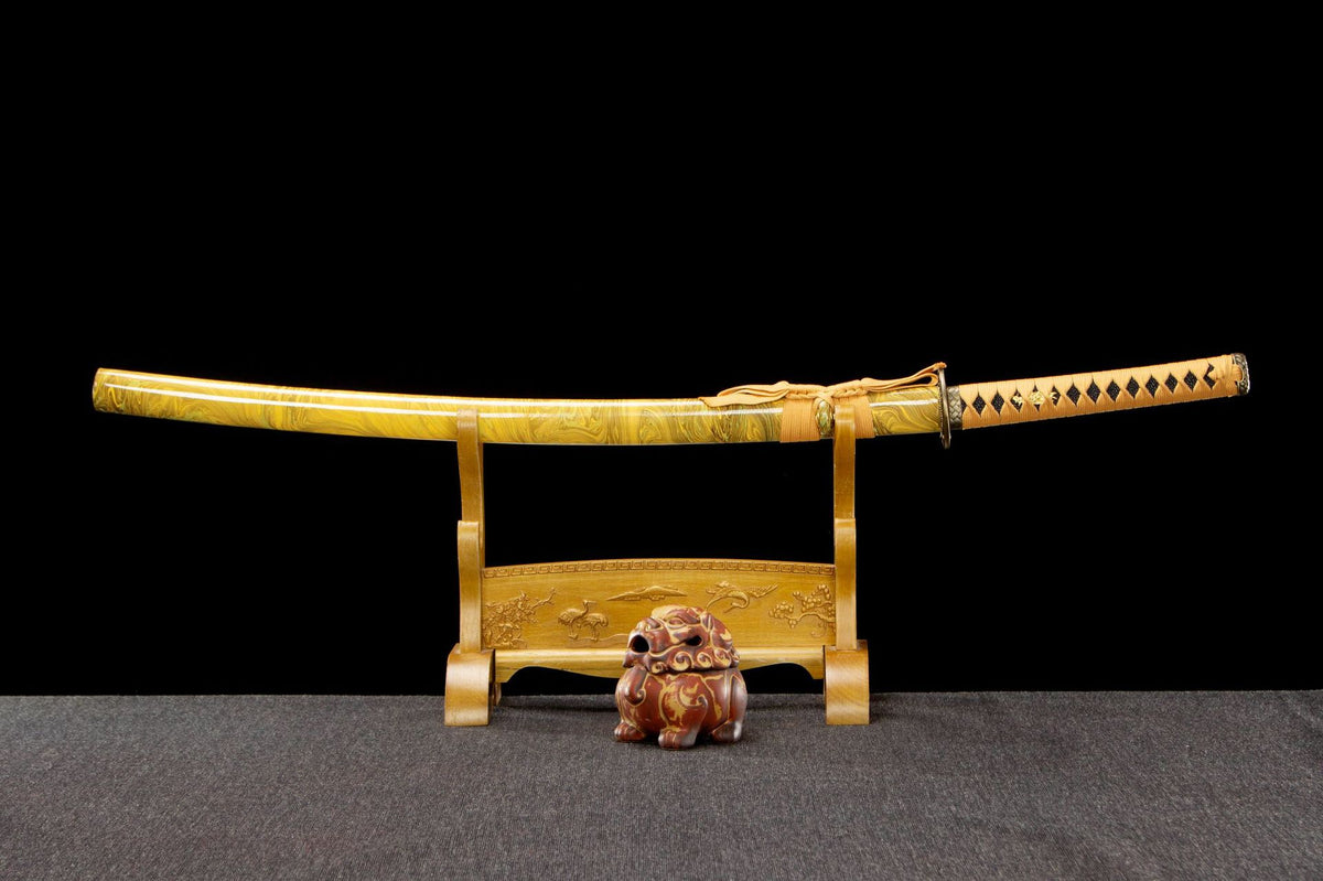 Golden Pearl Katana displayed sheathed with a gold handle and yellow marbled saya