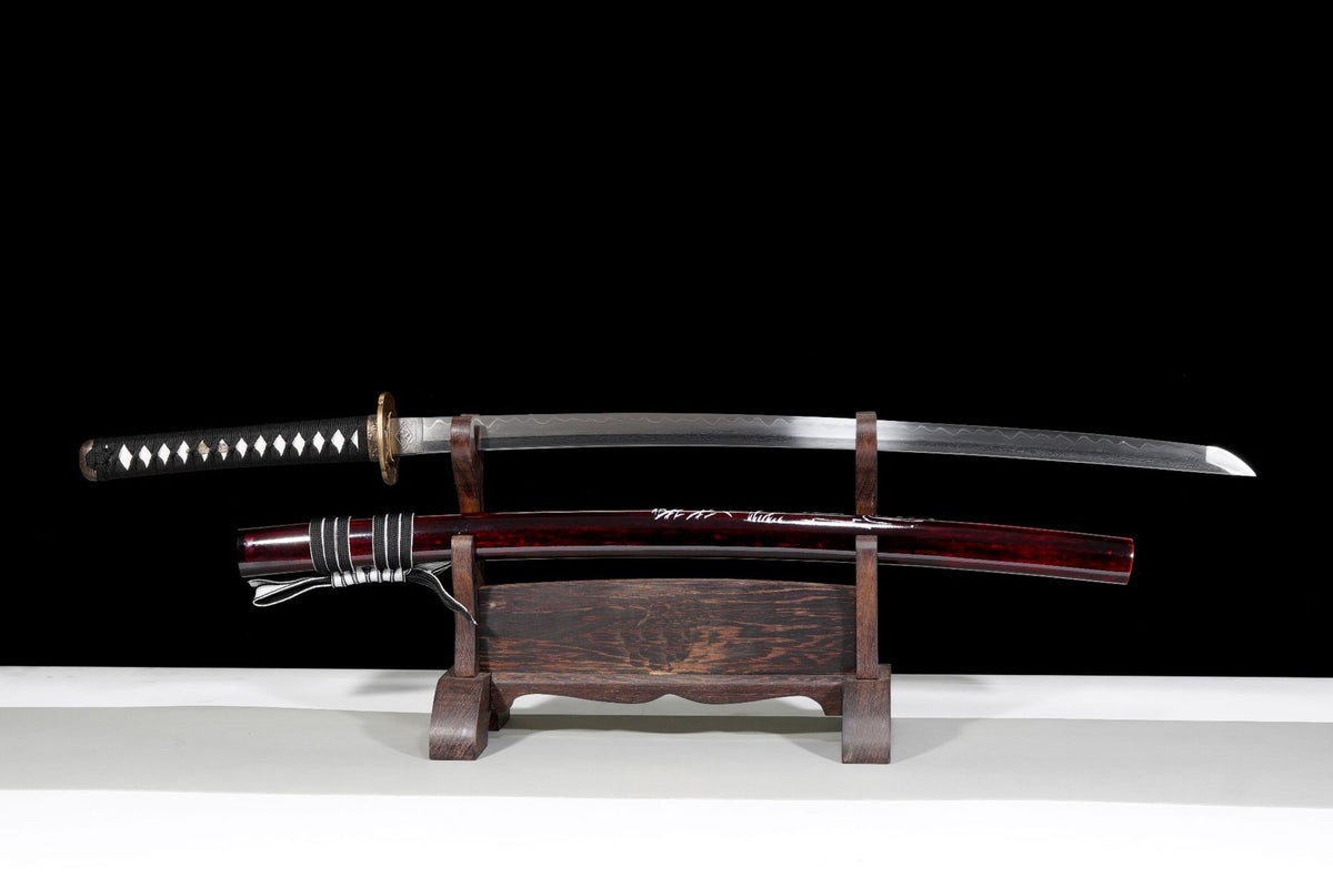 Red Crane Katana with drawn blade above its decorated saya