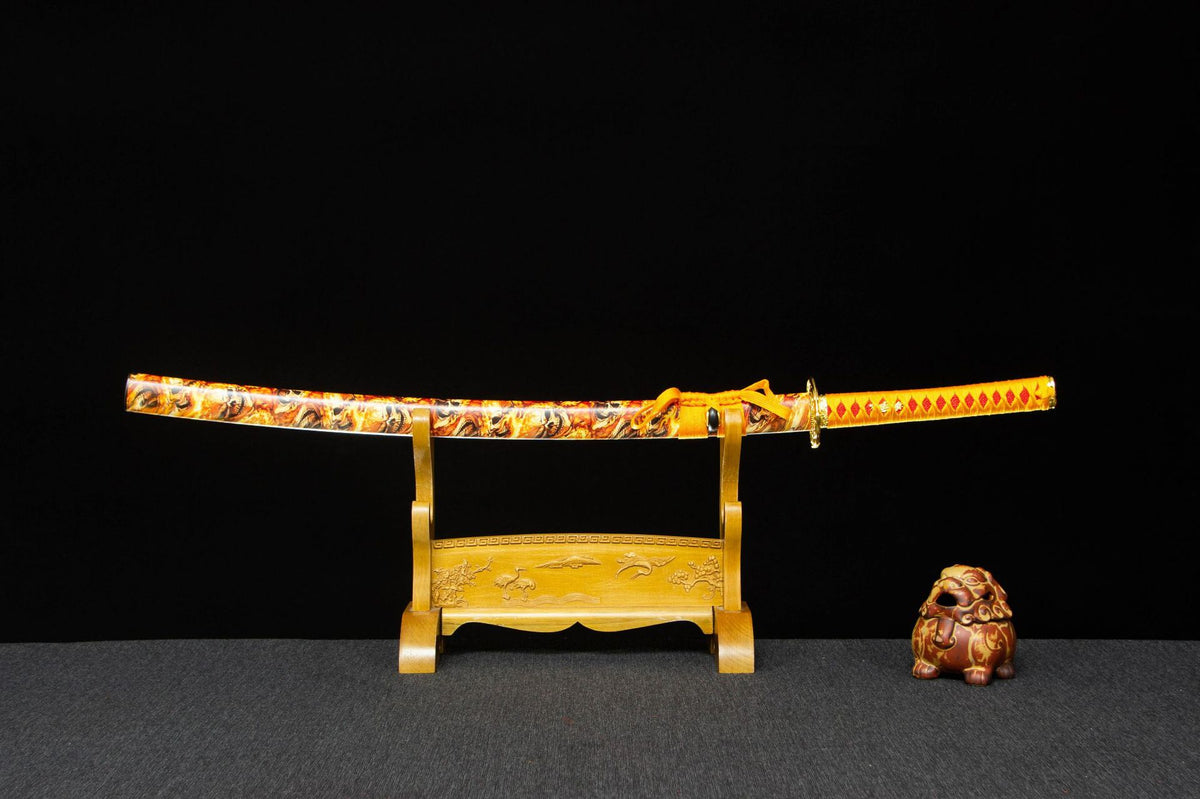 Twin Rivers Katana displayed sheathed with a gold dragon-patterned saya and orange handle wrap
