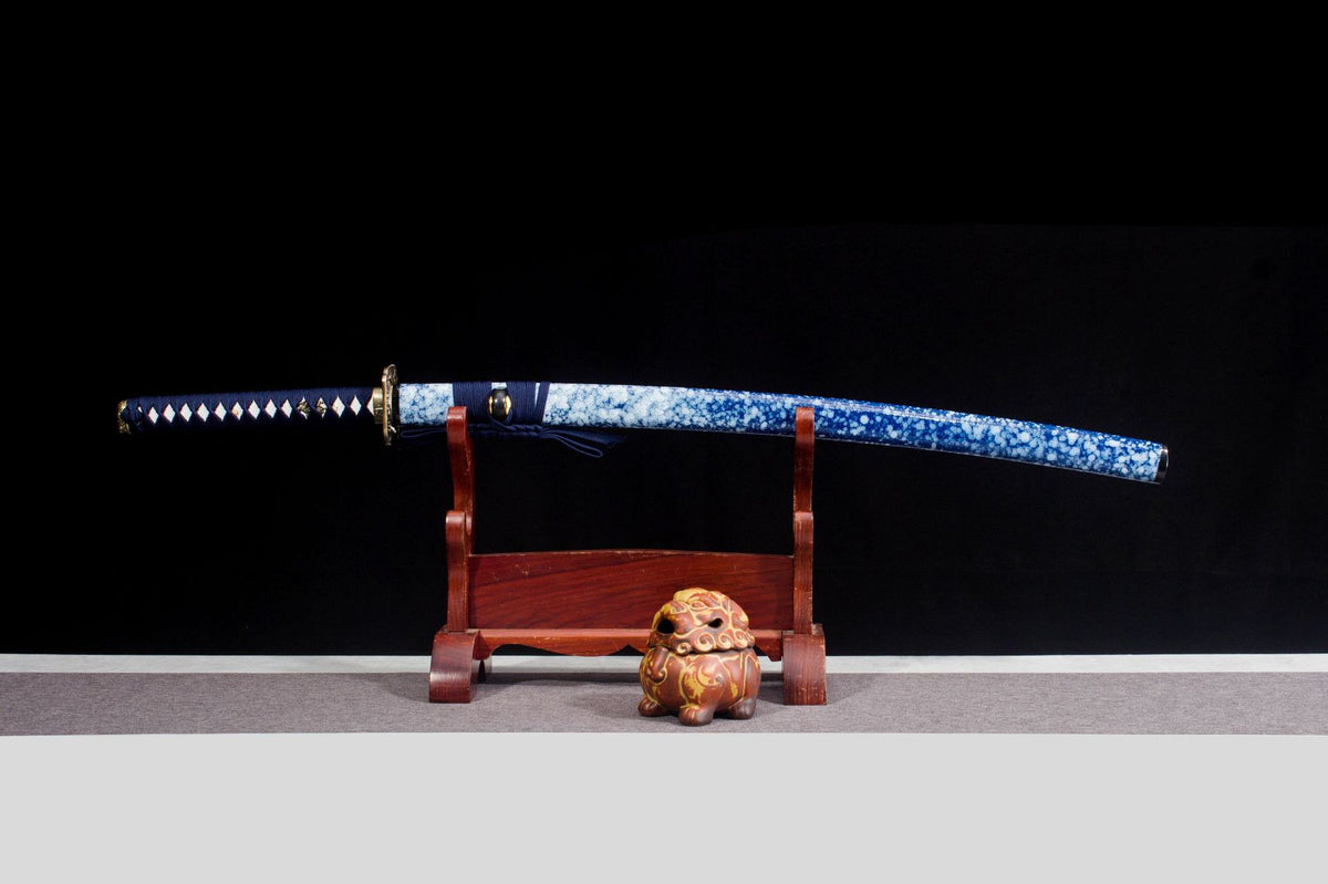 Indigo Frost Katana displayed sheathed with a blue-and-white speckled saya and navy handle wrap