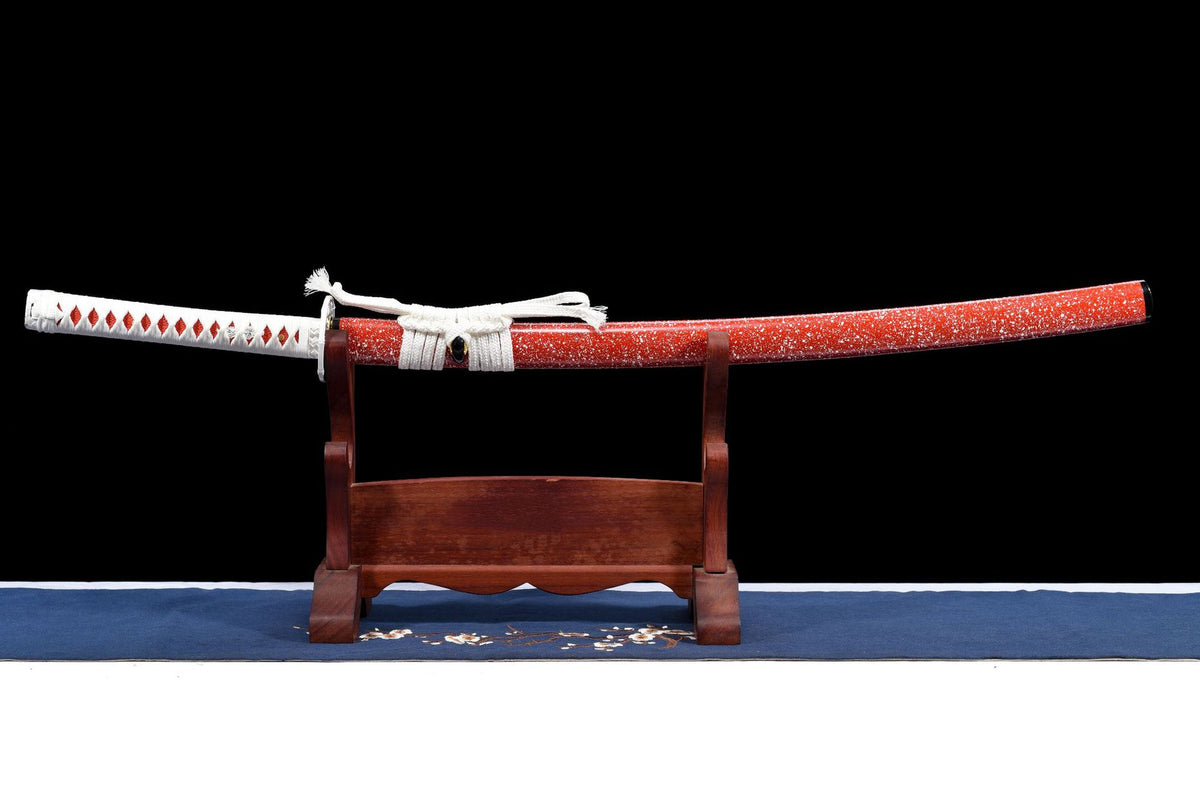 Red Speckle Katana in its red speckled saya with white sageo on a wooden stand