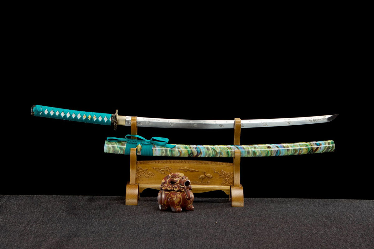 Turquoise Pearl Katana with a turquoise handle, pale engraved blade, and green marbled saya