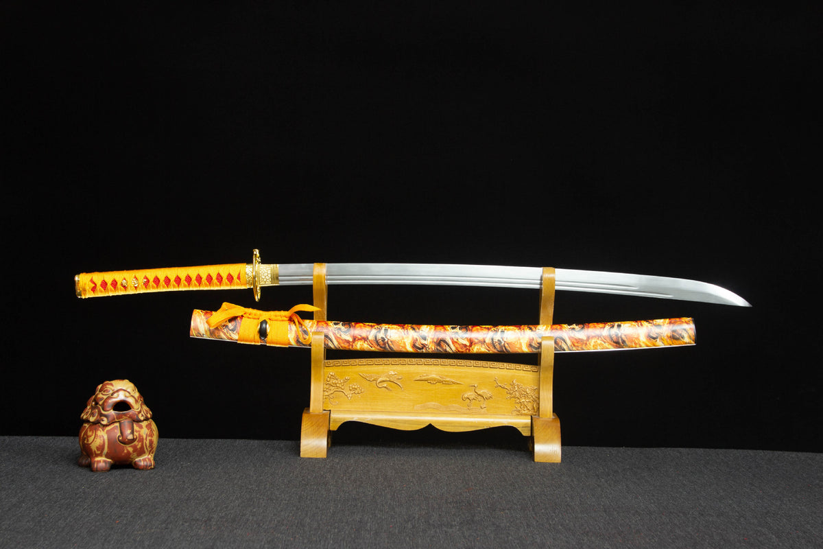 Twin Rivers Katana with an orange handle, twin blade grooves, and gold patterned saya