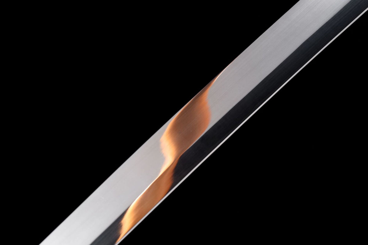 Detail view of the Twin Dragons Katana, showing the mirror-polished blade and black saya