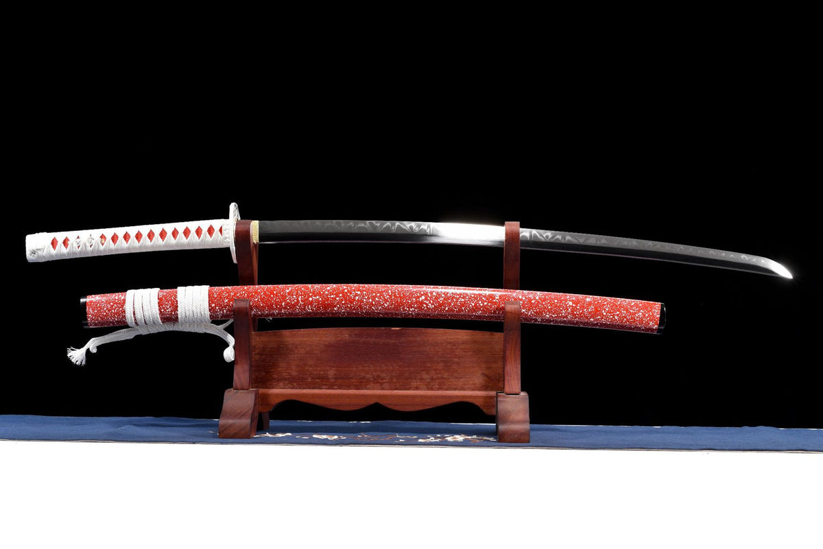 Red Speckle Katana and red speckled saya shown on a wooden display stand