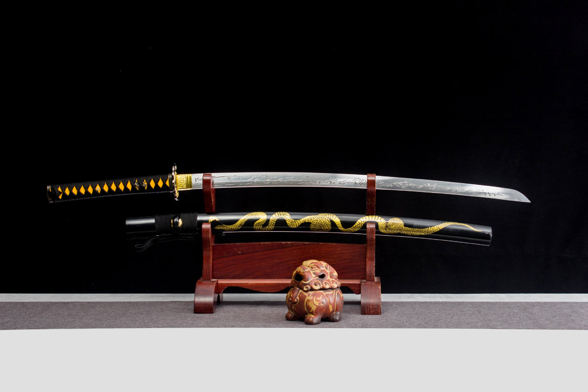 Gilded Coil Katana with an etched silver blade, black saya, and gold serpentine motif