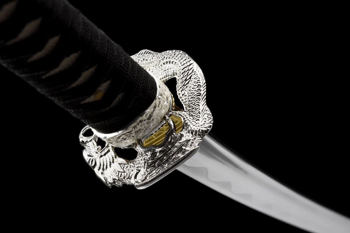 Silver-toned double-dragon alloy guard with black cord-wrapped handle
