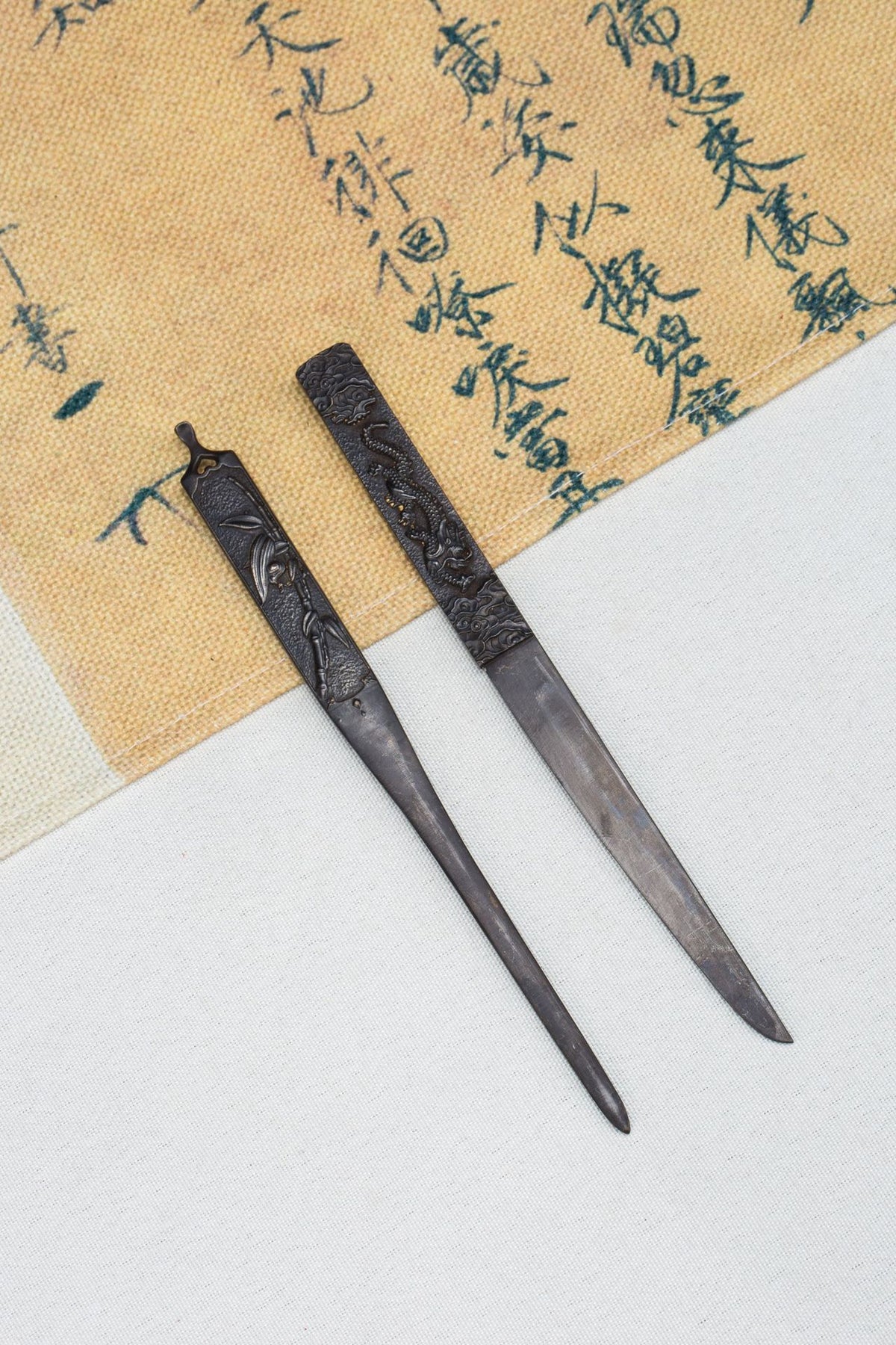 Blade, fittings, and red lacquer saya detail on the Cinnabar Katana