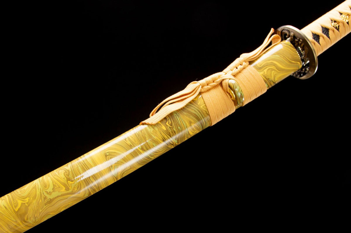 The Golden Pearl Katana with the warm-toned mounting details
