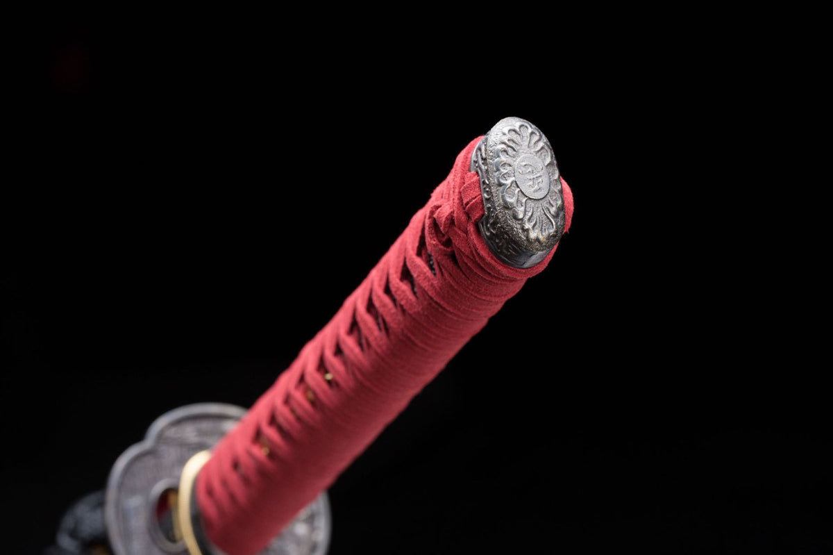 Red wrapped tsuka and end-cap detail on the Cinnabar Katana