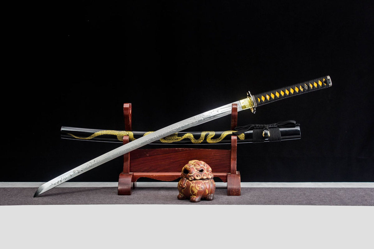 Gilded Coil Katana displayed unsheathed over a black saya with a gold serpentine motif