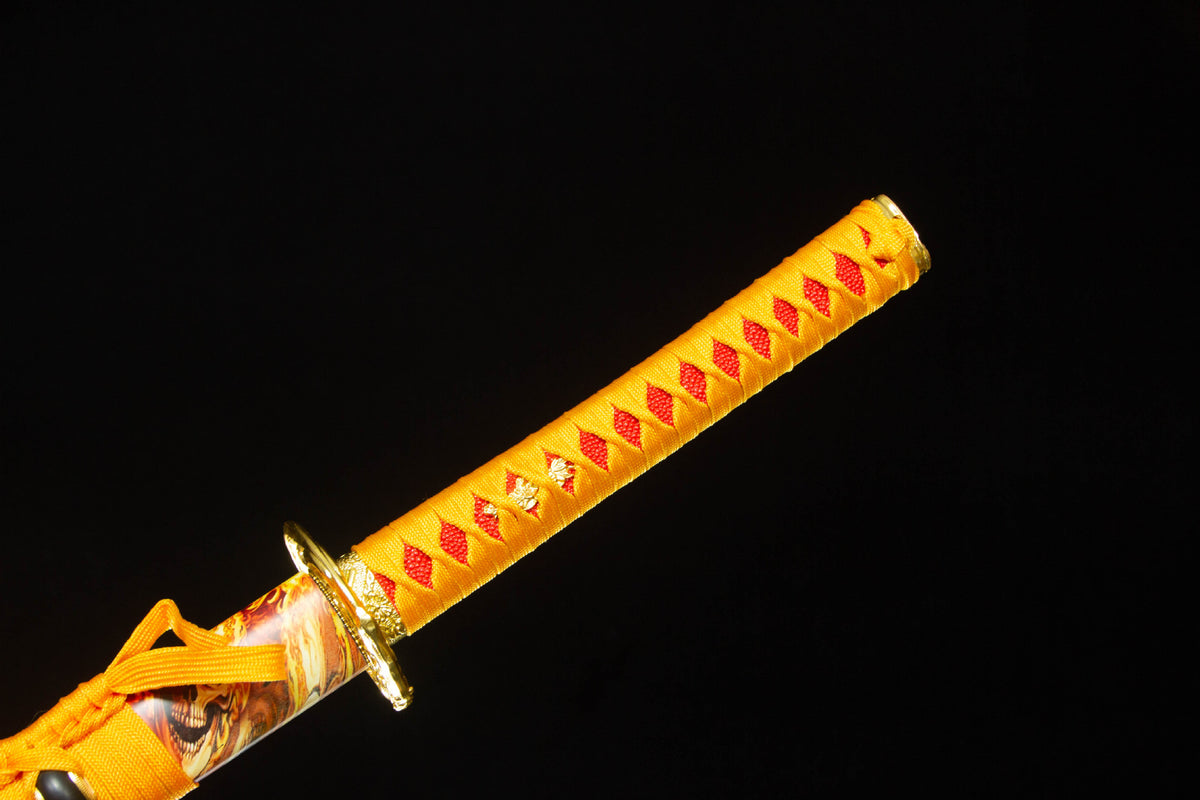 Close-up of the Twin Rivers Katana’s orange handle wrap, guard, and patterned saya