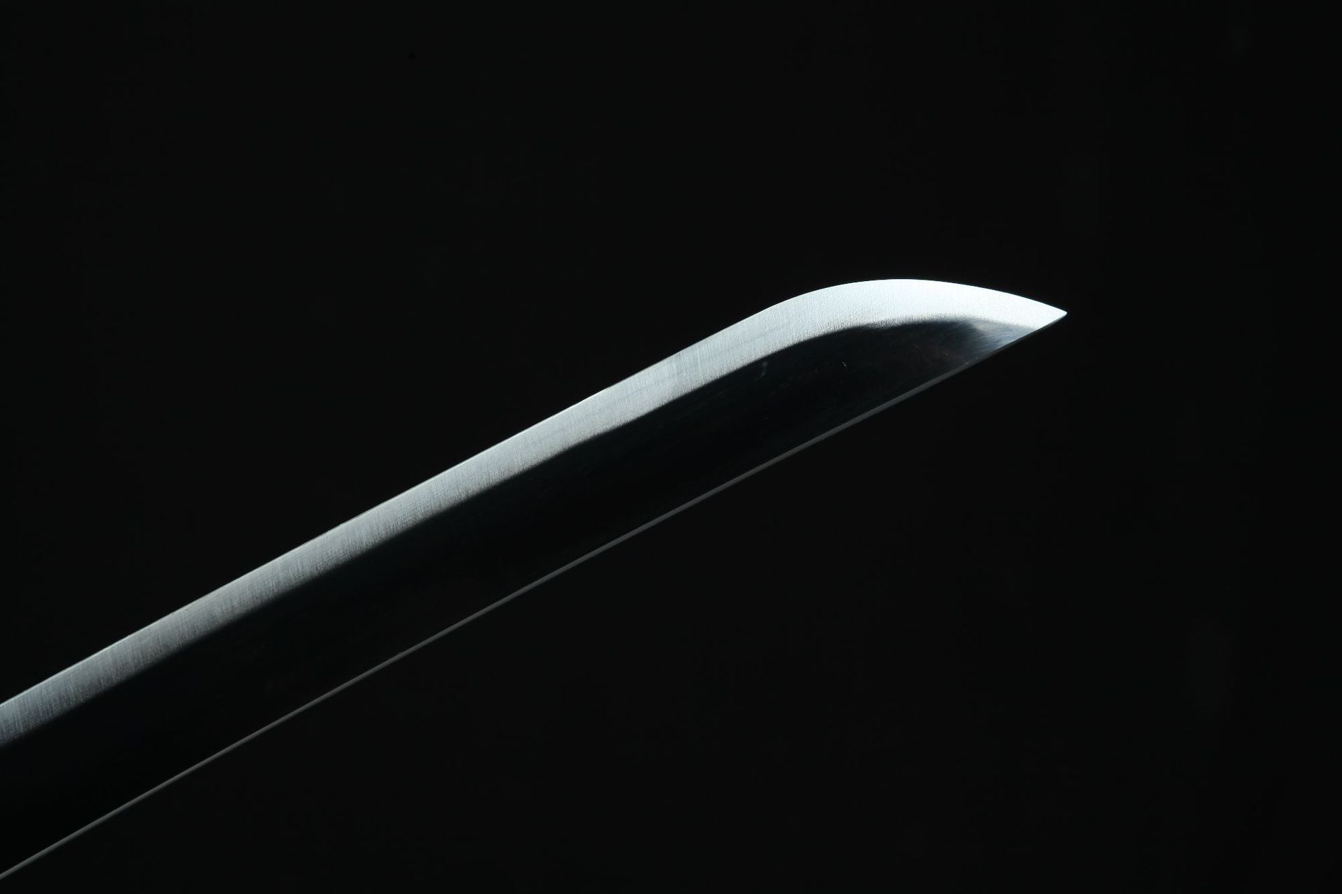 Close-up of the tip of the black Tanjiro Nichirin blade, highlighting craftsmanship. Perfect for collectors and fans of Demon Slayer.
