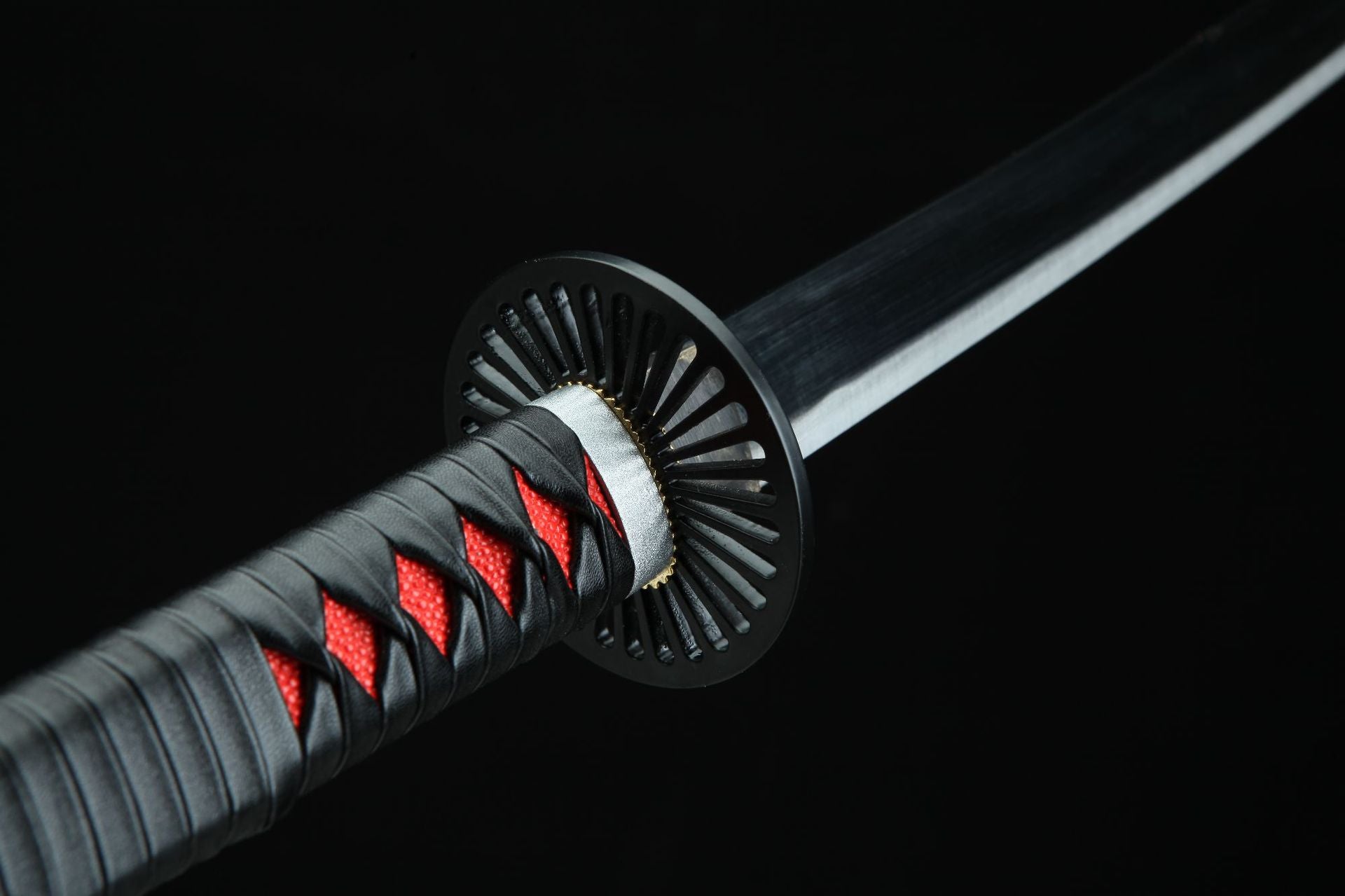 Tanjiro's first Nichirin blade featuring a round handguard, showcasing its distinctive design and craftsmanship.