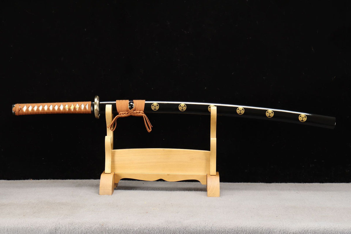 Sheathed Aoi Crest Katana with repeated Mitsuba Aoi motifs on its black saya