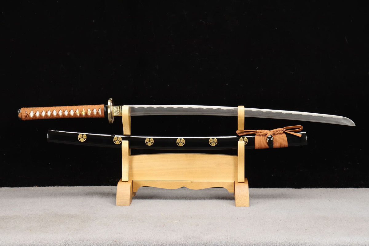 Aoi Crest Katana unsheathed beside its crest-patterned saya